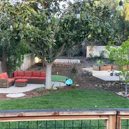 Backyard - Sierra installed a deck railing, our lawn, the multiple patios, planter boxes, putting green, retaining walls, and rock walls Backyard - Sierra installed a deck railing, our lawn, the multiple patios, planter boxes, putting green, retaining walls, and rock walls