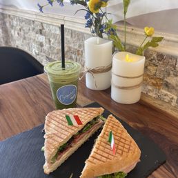 An Italian Panini and a green tea matcha. An Italian Panini and a green tea matcha.