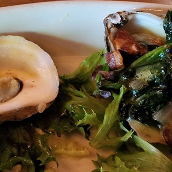 Phil's Tara Hideaway - PEI oysters prepare Millstreet Rockefeller style with spinach, garlic, butter, & bacon. - New American Near Me - Stillwater, Minnesota Phil's Tara Hideaway - PEI oysters prepare Millstreet Rockefeller style with spinach, garlic, butter, & bacon. - New American Near Me - Stillwater, Minnesota