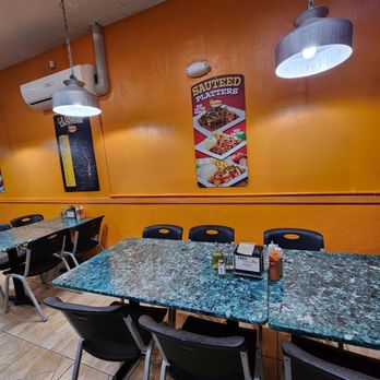 La Granja Restaurant - tables and chairs in a restaurant - Peruvian Near Me - Miami, Florida La Granja Restaurant - tables and chairs in a restaurant - Peruvian Near Me - Miami, Florida