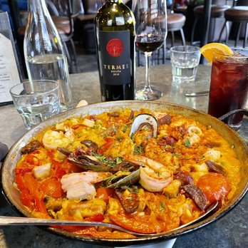 Elements Tapas - Preordered the house paella.  Sangria & Tempranillo  "Termes" Bodega Numanthia, 2016 Toro, Spain in the background - Lounges Near Me - Medford, Oregon