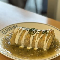 Claudine Kitchen & Bakeshop - Brisket Burrito (brisket, hash browns, scrambled eggs, salsa roja, cheddar & jack cheese, salsa verde, crema)