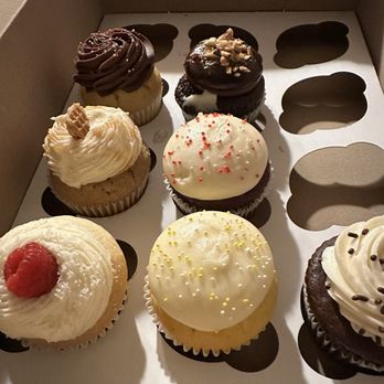 Camarillo Cupcake - White chocolate raspberry, lemon, chocolate, stroopwafel, red velvet, ferrero rocher, vanilla with chocolate frosting. - Cupcakes Near Me - Camarillo, California Camarillo Cupcake - White chocolate raspberry, lemon, chocolate, stroopwafel, red velvet, ferrero rocher, vanilla with chocolate frosting. - Cupcakes Near Me - Camarillo, California