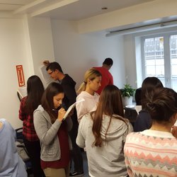Global ESL Academy - During a party for all levels/classes, students work on an activity that helped them practice English and meet other students.