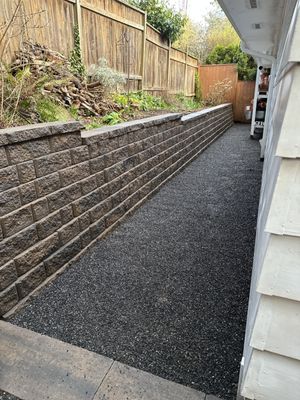 Retaining Wall - Stunning block retaining wall with steps installed to create more usable space in the back of the home. Retaining Wall - Stunning block retaining wall with steps installed to create more usable space in the back of the home.