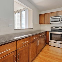 Hyde Park Tower by AIMCO Property Management - Enjoy a newly-renovated kitchen with granite countertops and stainless steel appliances