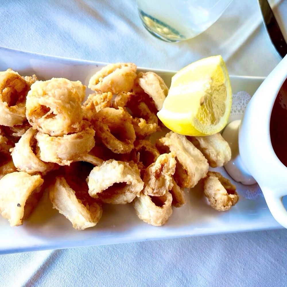Via Alloro - Calamari Fritti with spicy tomato sauce. - Italian Near Me - Beverly Hills, California Via Alloro - Calamari Fritti with spicy tomato sauce. - Italian Near Me - Beverly Hills, California