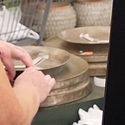 Employee pulling off the bar code noting it was a 3-piece set after I called them on being fraudulent, unethical and is false advertising.