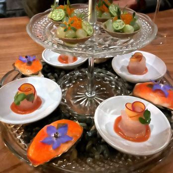 Lazy Bear - Seafood tower w/ Kusshi Oysters w/ topped w/ purple flower, Halibut w/ nectarine and Trout roe on top- my favorite - New American Near Me - San Francisco, California