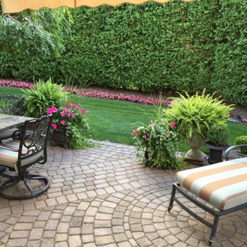 Craig Adam's Landscaping - a patio with a table and chairs - Landscaping Near Me - Wixom, Michigan Craig Adam's Landscaping - a patio with a table and chairs - Landscaping Near Me - Wixom, Michigan