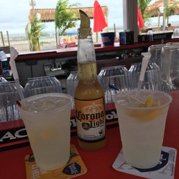 a bottle of corona beer and a glass of lemonade a bottle of corona beer and a glass of lemonade
