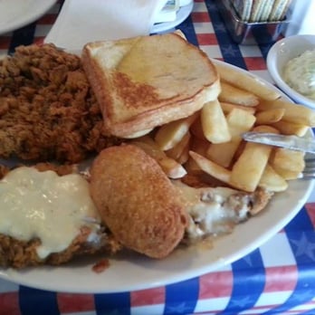 T-Bone Tom's - The large chicken fried stead (2-6 oz steaks) and an Armadillo egg in the center. - Barbeque Near Me - Kemah, Texas T-Bone Tom's - The large chicken fried stead (2-6 oz steaks) and an Armadillo egg in the center. - Barbeque Near Me - Kemah, Texas