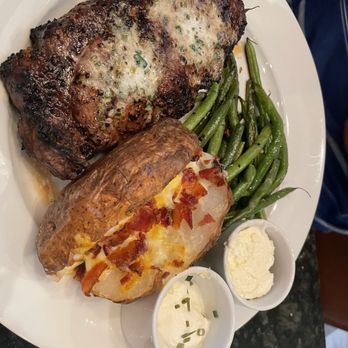Stone Creek Dining - Ribeye 14 oz.* w/ loaded baked potato - Steakhouses Near Me - Plainfield, Indiana