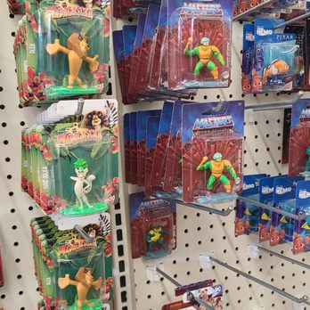 Dollar Tree - Display of plastic character figurines from 'The Lion King' and 'Madagascar' series on peg hooks in a retail store. - Discount Store Near Me - Arvada, Colorado