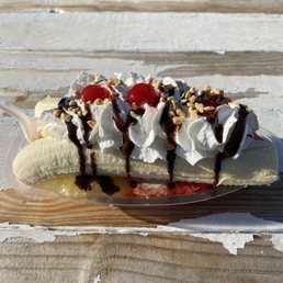 a banana split on a wooden table