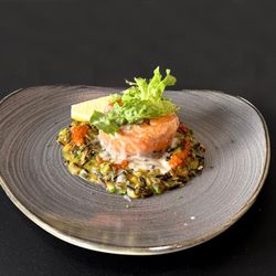 Salmon Tournedos Catalonia, Wild Rice, Mustard Greens, Roasted Bell Pepper-Smoked Pimento Coulis.