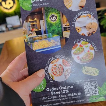 Urban Press - a person holding up a menu - Salad Near Me - Flushing, New York