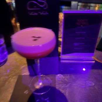 White Whale - A blurry picture of espresso martini the best in downtown change my mind - Cocktail Bars Near Me - Las Vegas, Nevada