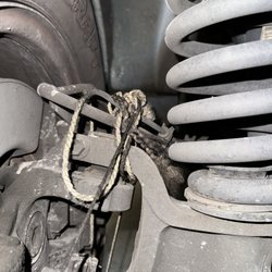 Meineke Car Care Center - The string they left tied to the my brake lines.