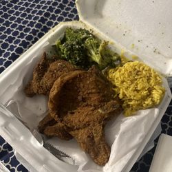 Taste Of Flavors - 2 Piece Pork Chop Dinner  Yellow Rice and Broccoli