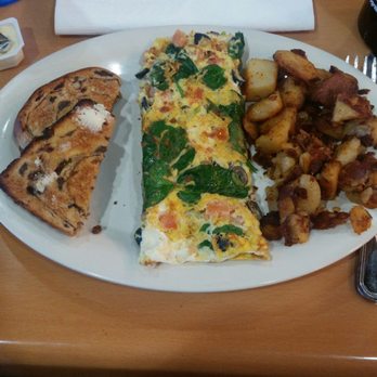 Eggs Up Grill - Yum! Greek Omlet with Home fried Potatoes and raisin toast. - Breakfast & Brunch Near Me - North Myrtle Beach, South Carolina Eggs Up Grill - Yum! Greek Omlet with Home fried Potatoes and raisin toast. - Breakfast & Brunch Near Me - North Myrtle Beach, South Carolina