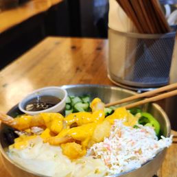 Shrimp poke with cali mix, half sushi rice half greens. Perfect shrimp tempura!!!!