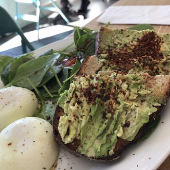 Casa Latina - Avo toast w/ poached eggs + small spinach salad - Mexican Near Me - Berkeley, California Casa Latina - Avo toast w/ poached eggs + small spinach salad - Mexican Near Me - Berkeley, California