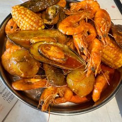 Meet Sushi and Boil - Corn, potatoes, shrimp and mussels in house blend sauce