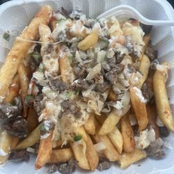 Tacos Los Amigos - Hard overcooked fries with no seasoning. A tiny bit of sour cream and cold cheese.
