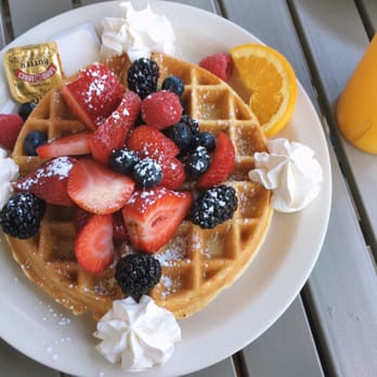 Ball Square Cafe - Tri berry waffle with their fresh squeezed OJ - Breakfast & Brunch Near Me - Somerville, Massachusetts