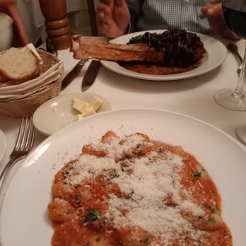 Sam's Place - Gnocchi vodka sauce in front Veal chop in back - Italian Near Me - New York, New York Sam's Place - Gnocchi vodka sauce in front Veal chop in back - Italian Near Me - New York, New York
