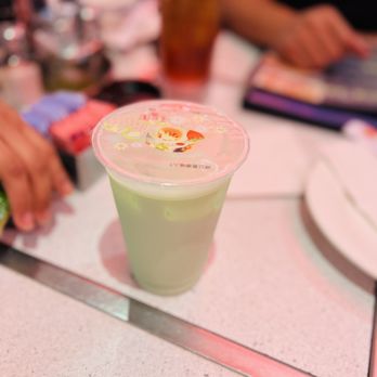 Tan Tan - a person sitting at a table with a drink in a plastic cup - Chinese Near Me - Houston, Texas Tan Tan - a person sitting at a table with a drink in a plastic cup - Chinese Near Me - Houston, Texas