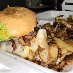 Sunrise Inn - The "I'll Never Fall in Love Again" burger with a blue cheese spread, black pepper bacon, provolone cheese, lettuce. Side of potato skins.