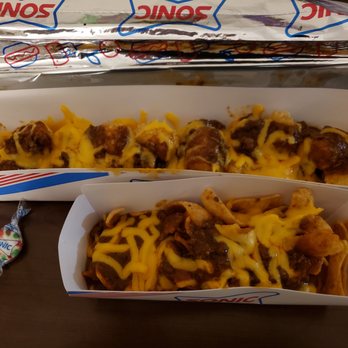 Sonic Drive-In - unwrapped chilli cheese tots with secret menu item Frito pie - Burgers Near Me - Westlake, Louisiana