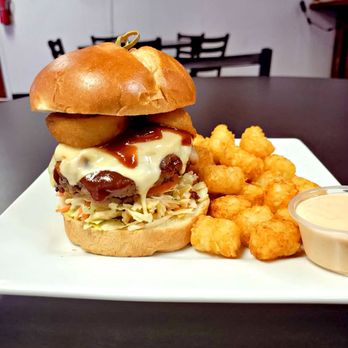 Happy Hour - A Mace Special! BBQ Bacon Cheese Burger Topped w/ Chipotle Coleslaw, Tomato, Red Onion -- Smothered in BBQ Sauce + Onion Rings - Beer, Wine & Spirits Near Me - Twin Falls, Idaho Happy Hour - A Mace Special! BBQ Bacon Cheese Burger Topped w/ Chipotle Coleslaw, Tomato, Red Onion -- Smothered in BBQ Sauce + Onion Rings - Beer, Wine & Spirits Near Me - Twin Falls, Idaho