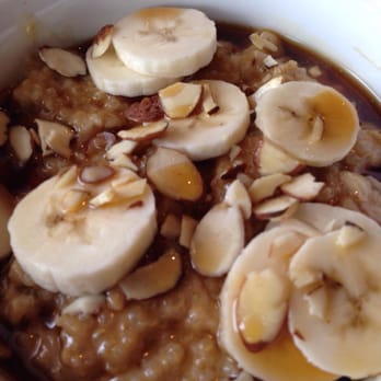 Crave Kitchen and Bar - Protein oatmeal doused in honey. Had to spoon all the honey out but even then it was way too sweet. - New American Near Me - El Paso, Texas