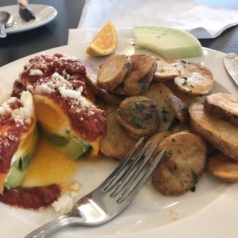 Eggspectation - Poached eggs on avocado with tomato sauce and cheddar and feta cheese with potatoes - Bars Near Me - Richmond, British Columbia Eggspectation - Poached eggs on avocado with tomato sauce and cheddar and feta cheese with potatoes - Bars Near Me - Richmond, British Columbia