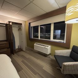 Holiday Inn Express Salt Lake City Downtown - Sitting area, storage drawers, closet, and ironing equipment.