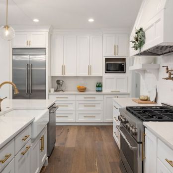 Spaces General Contracting - Luxurious kitchen transformation. White premium cabinets, beautiful wood floor, and elegant gold cabinet pulls. Timeless opulence reimagined - General Contractors Near Me - Seattle, Washington Spaces General Contracting - Luxurious kitchen transformation. White premium cabinets, beautiful wood floor, and elegant gold cabinet pulls. Timeless opulence reimagined - General Contractors Near Me - Seattle, Washington