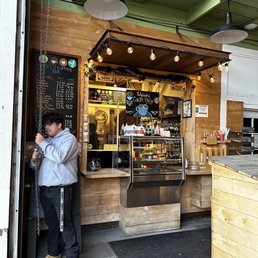 a man standing in front of the counter a man standing in front of the counter