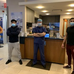 Photo of Manhattan Lasik Center - New York - New York, NY, US. Cousins Zaki and Zaher pose with Dr. Niksarli after their SMILE procedure!