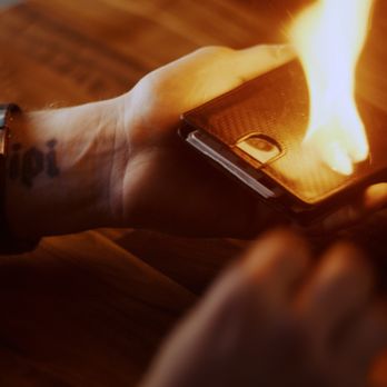 Deceptions Magic Show - a hand holding a lighter - Performing Arts Near Me - Milwaukee, Wisconsin