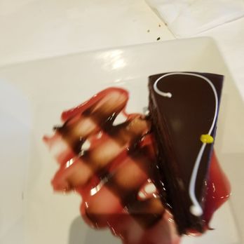 Mi Piace - Midnight fantasy. Decadent chocolate cake with a rasberry and chocolate sauce. - Italian Near Me - Pasadena, California Mi Piace - Midnight fantasy. Decadent chocolate cake with a rasberry and chocolate sauce. - Italian Near Me - Pasadena, California