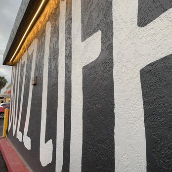 Better Buzz - The cute wall decor outside the drive thru window (sorry for the angle guys!) - Coffee & Tea Near Me - San Diego, California