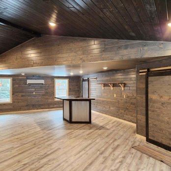 Rock Solid - Complete interior with handmade barn doors and handmade bar - General Contractors Near Me - Menahga, Minnesota