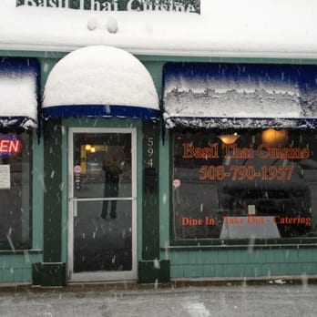 Basil Thai - the front of a restaurant in the snow - Thai Near Me - ​West Yarmouth, Massachusetts