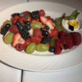 Novikov - Beautiful arrangement of fruit with whipped cream on the side. - Mediterranean Near Me - Beverly Hills, California