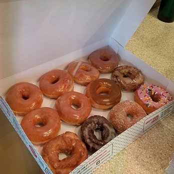 Krispy Kreme - One dozen of mixed donuts, $9.99. I got half original glazed, and the rest maple, blueberry, sour cream, strawberry sprinkles, chocolate. - Donuts Near Me - Vacaville, California
