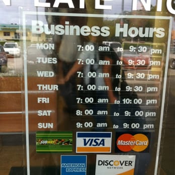 Subway - a business hours sign in a window - Sandwiches Near Me - Delray Beach, Florida