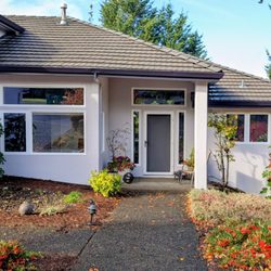 Terry Harris Painting - The house body was done in the color Destiny, the gutters in Black swan, and the garage door trim white.